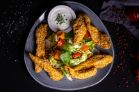 Fried chicken breast strips in breadcrumbs - 