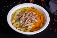 Broth with vermicelli or with liver dumplings in a bowl - 