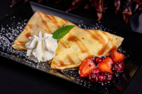 Cottage cheese pancake with forest fruits, whipped cream and strawberry topping - 