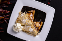 Gundel pancake (raisin-walnut cream) with chocolate sauce and whipped cream - 